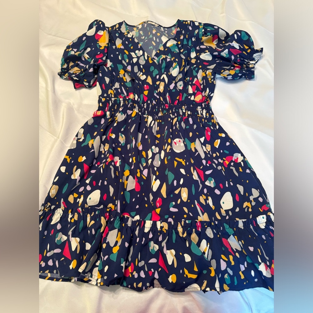 Cutesy cobalt blue with colorful geometric shapes!